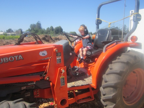Our son Jake on a tractor. Future farmer?