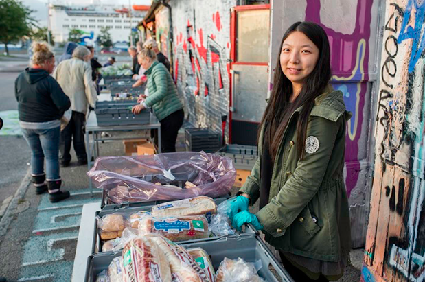 A Solikyl volunteer waits for someone to approach her table. Photo credit: Rikard Rensfelt