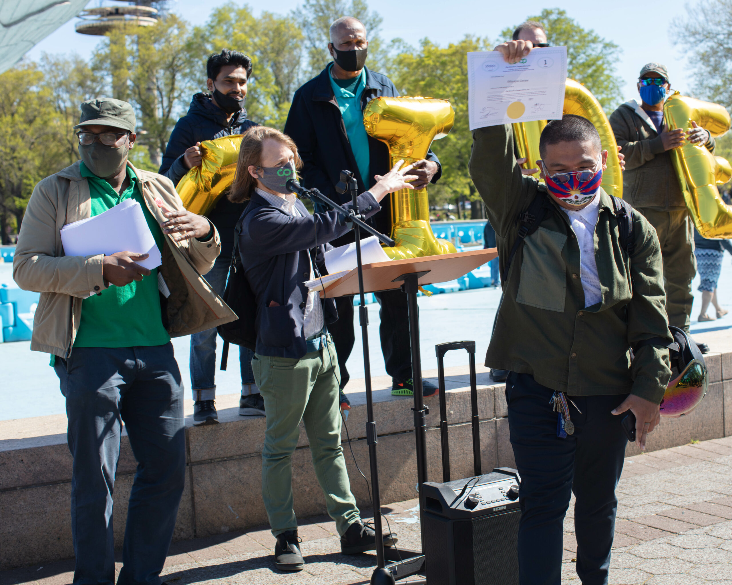 Member-owners of The Driver Cooperative ceremoniously gather to receive shares of the operation.