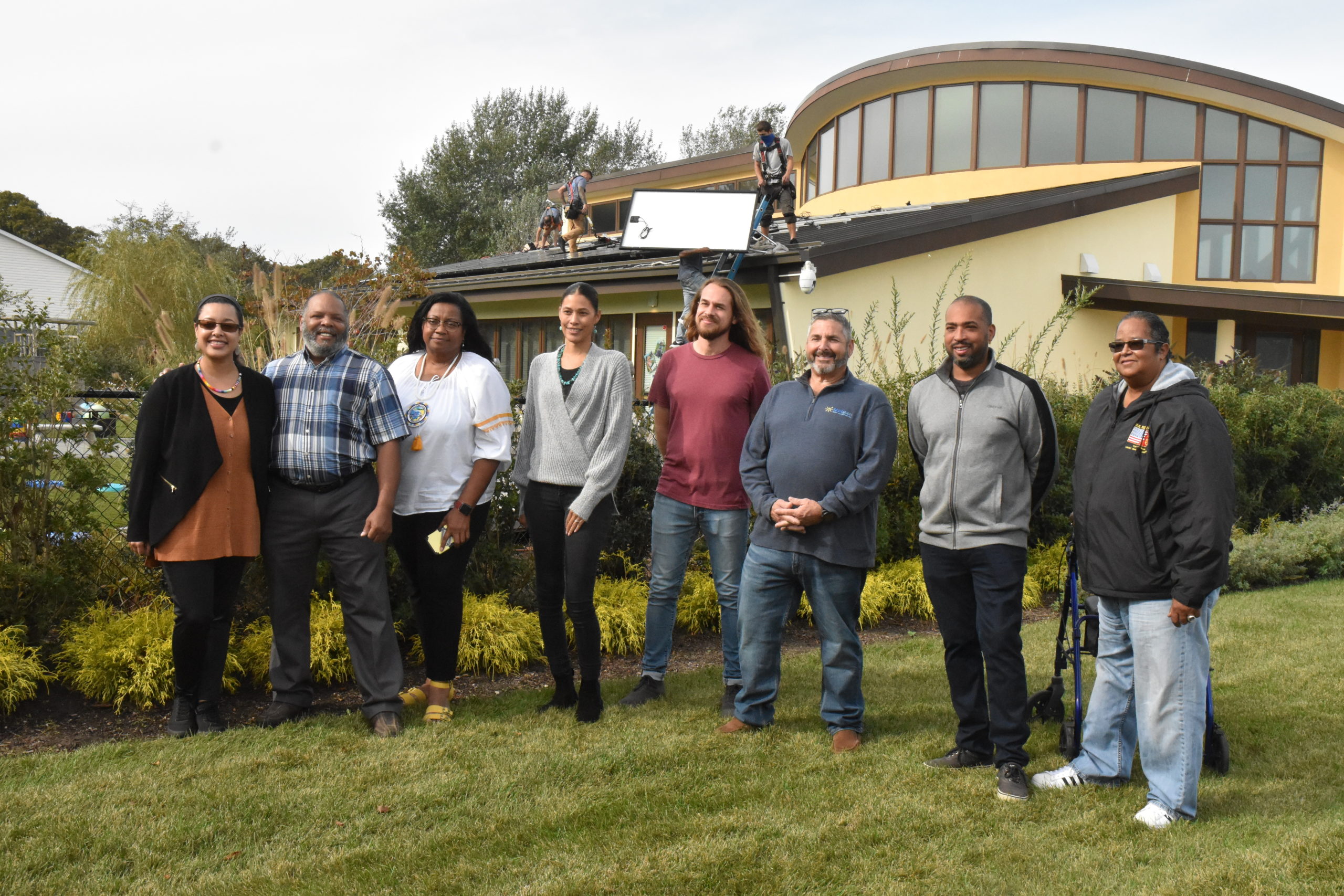 energy; Members of the Shinnecock Indian Nation stand alongside representatives from the SUNation and the Long Island Progressive Coalition, celebrating the installation of solar panels on the Wuneechanunk Shinnecock Preschool. Credit: Stephen J. Kotz
