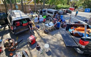 crews organize in a parking lot in Asheville NC post hurricane helene