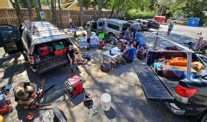 crews organize in a parking lot in Asheville NC post hurricane helene
