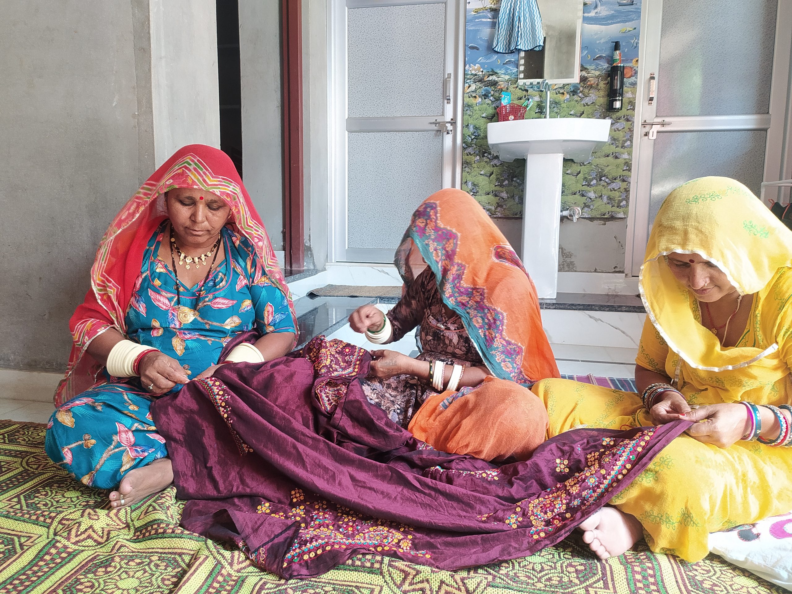 hree women artisans working on traditional Sindhi embroidery in Barmer, Rajasthan, India.